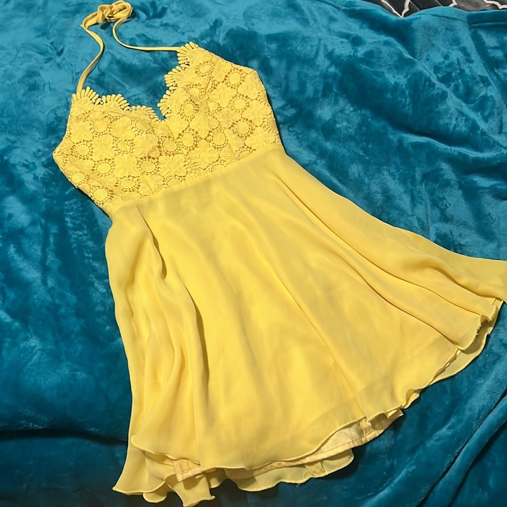 BEBE- Mini bright yellow open back dress